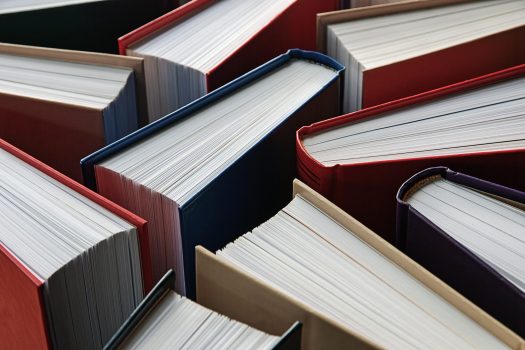 many hardbound paper books standing, literature background